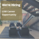 Office reception area with floating staircase, with banner text reading We're Hiring - LSM Career Opportunity.